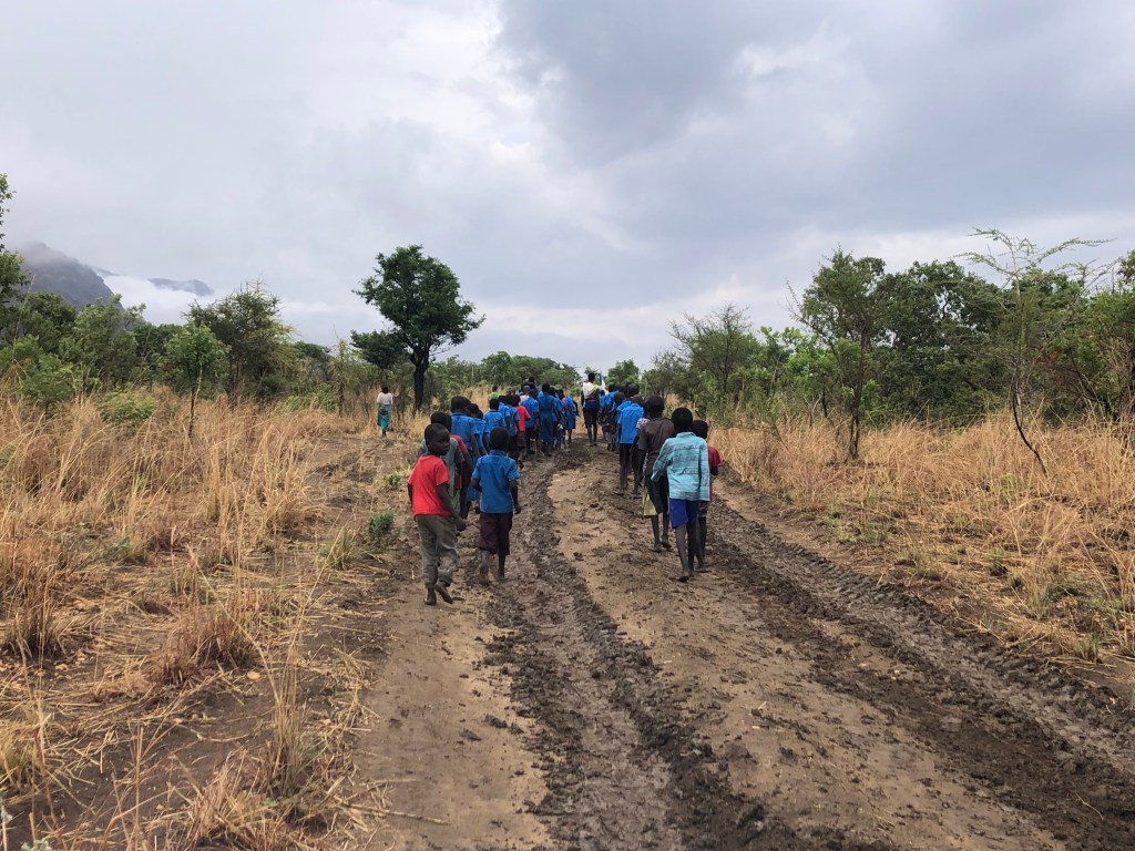 Children walking on a mud road in South Sudan